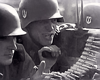 German SS shock troops machine gunning enemy positions in the relentless German push east in 1941.